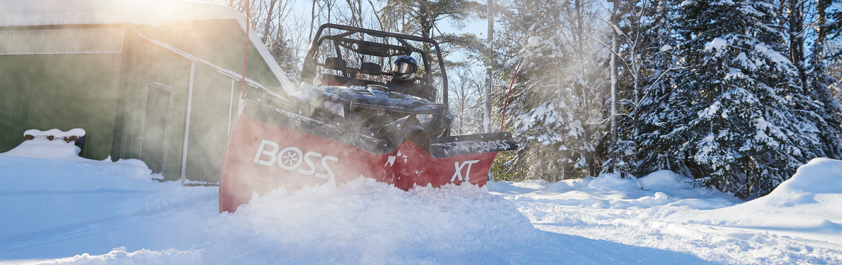 UTV plowing snow with a BOSS ATV/UTV XT plow